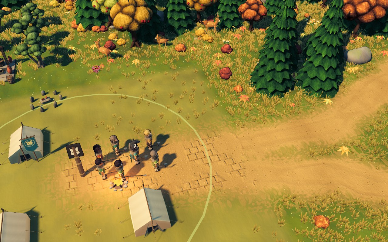 The tribe’s camp surrounded by golden autumn trees.